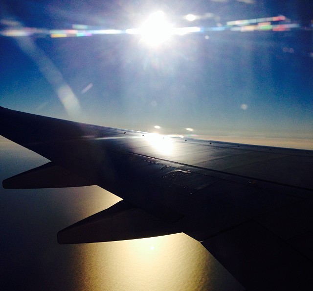 travel light airplane sunset ocean passport europe asia airline zen mindfulness
